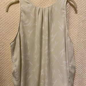 A new day light cream tank. XXL w/leaf design